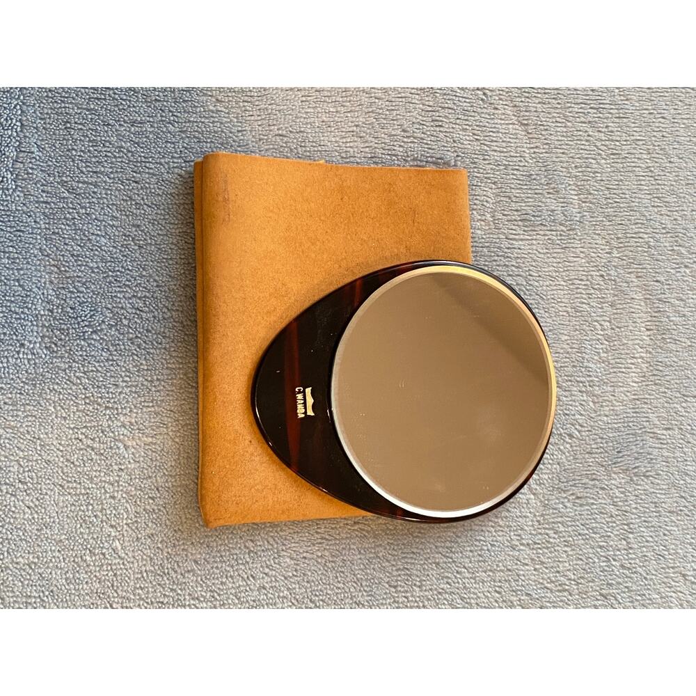 Hand mirror in deerskin pouch